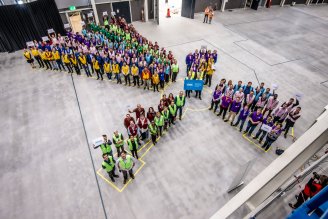 Participants at the handover ceremony form the layout of the instrument suite inside the Long Instrument Hall Photo: Roger Eriksson/ESS