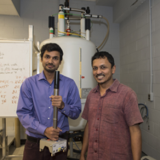 Anand Yethiraj (right) and graduate student Swomitra Palit (left) in the Nuclear Magnetic Resonance lab at Memorial University.